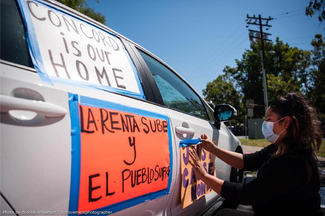 Woman sticks messages to a car.