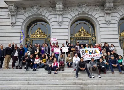 Group posing on top of stairway.